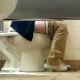 A guy video-records women using the toilet in a Wal-Mart restroom in many scenes. Some pooping sounds and grunting are audible. The view is from under the stall wall, so no faces are visible. About 14 minutes. 201MB, MP4 file requires high-speed Internet.